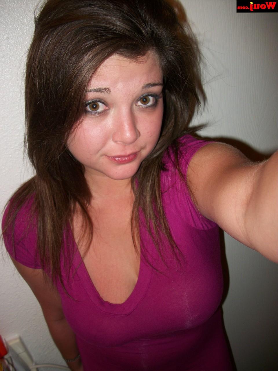 15P Brunette amateur WouJ flaunts her cleavage wearing a shiny pink dress
