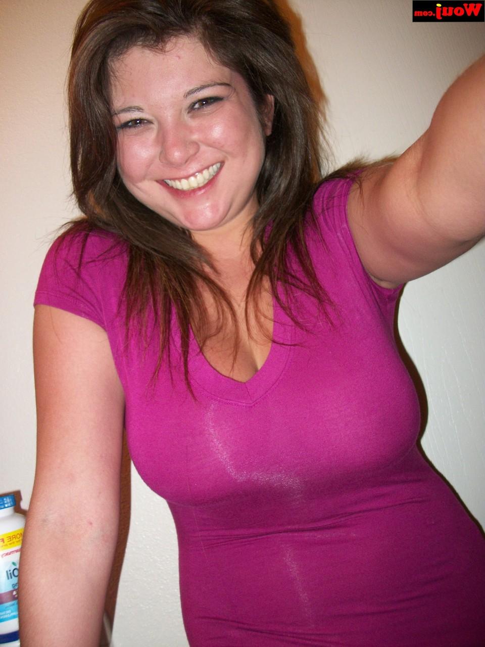 15P Brunette amateur WouJ flaunts her cleavage wearing a shiny pink dress