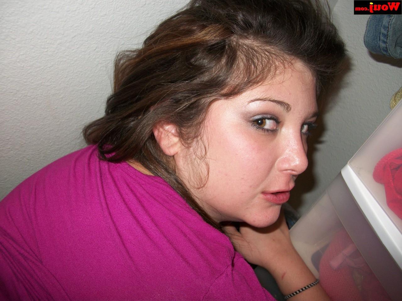 15P Brunette amateur WouJ flaunts her cleavage wearing a shiny pink dress