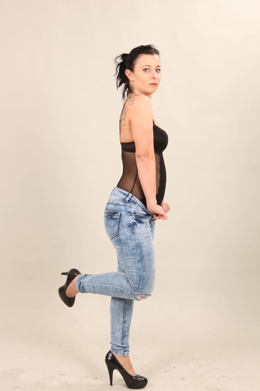 18P Hot photo buff Bonny Devial sheds jeans & exposes small tits in hot striptease