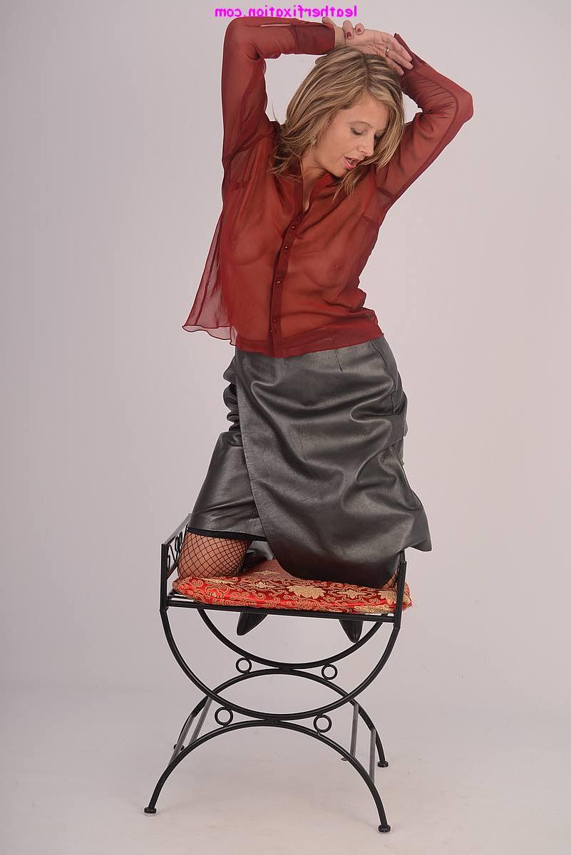 15P Clothed lady Louise models in leather skirt and boots paired with fishnets