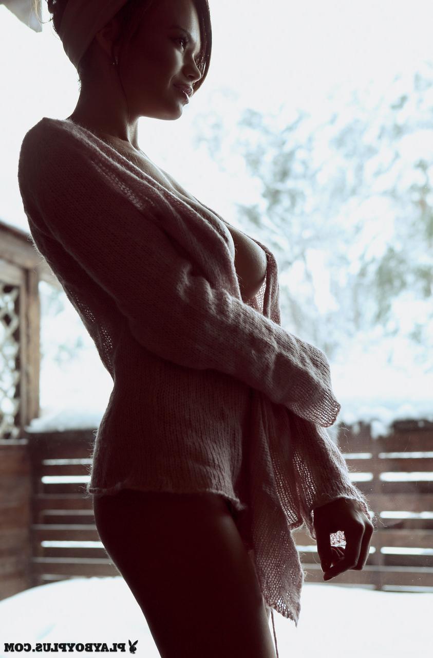 15P Busty Ukrainian babe Olga Ogneva poses half naked outside on cold winter day