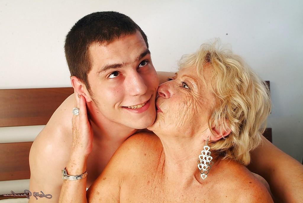 16P Lustful granny with massive jugs gets her hairy cunt pleased by a younger lad