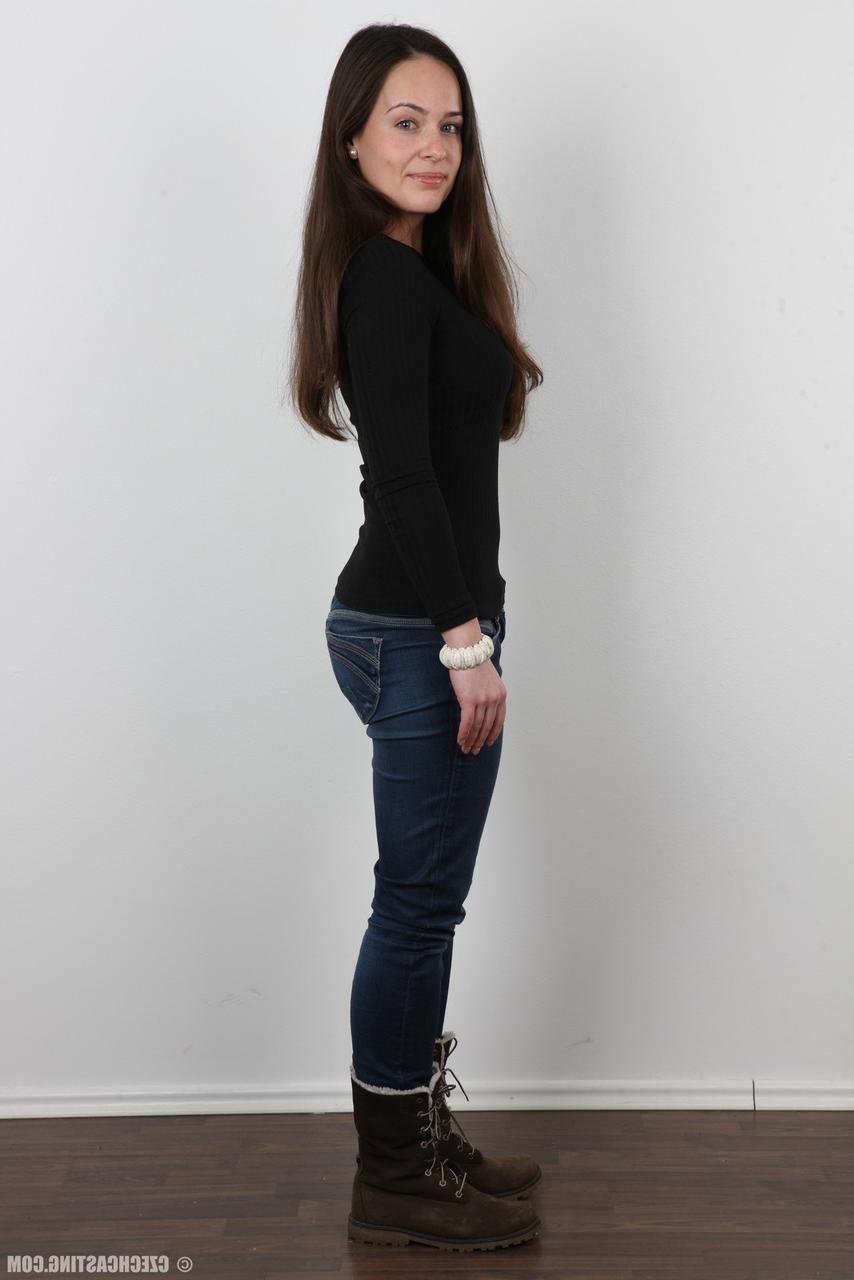 20P Gorgeous brunette in jeans peels slowly for this photo striptease series