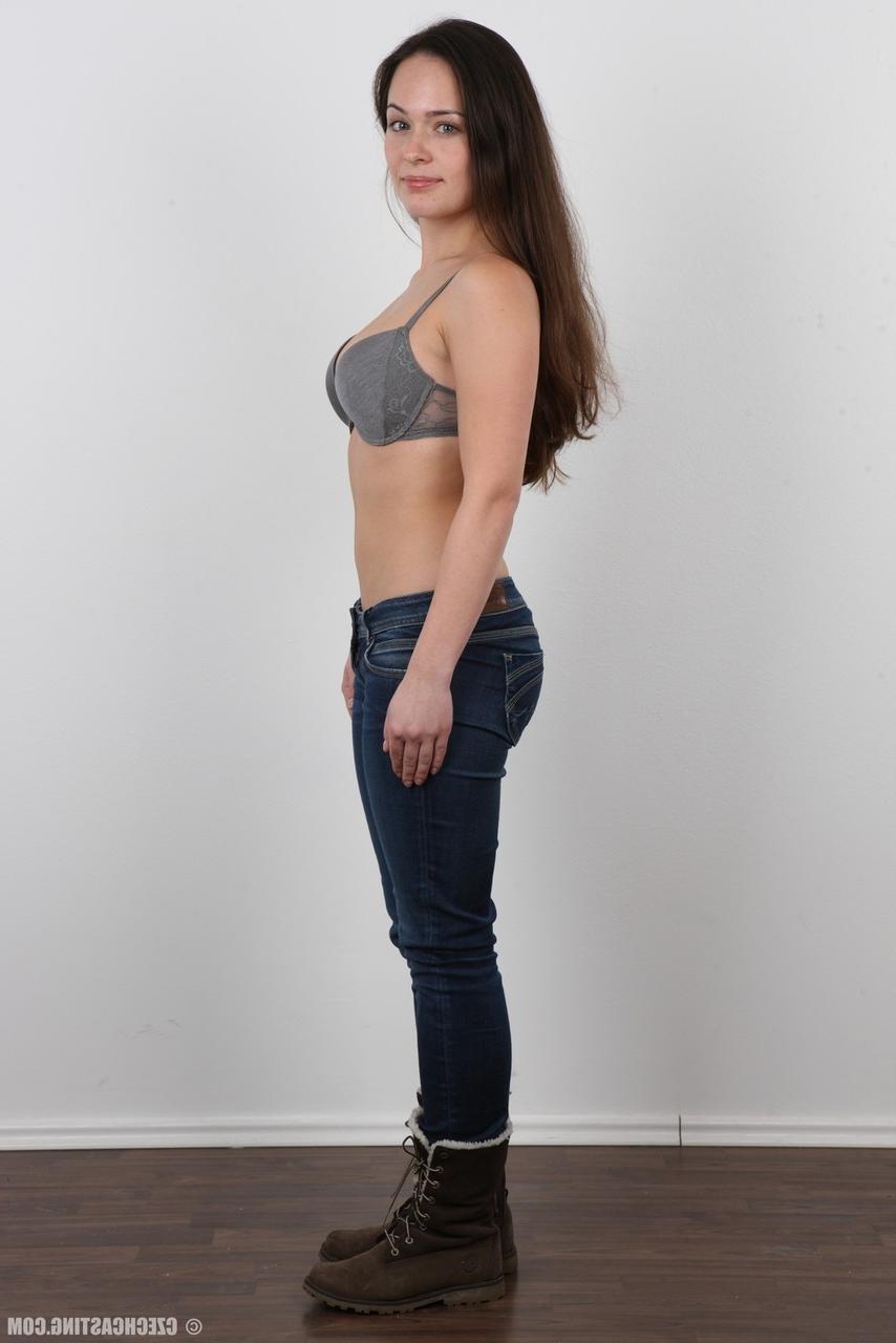 20P Gorgeous brunette in jeans peels slowly for this photo striptease series