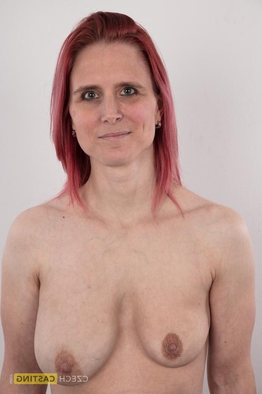 20P Redhead amateur Kveta shows her mismatched breasts while standing naked
