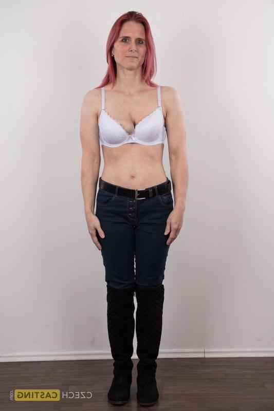 20P Redhead amateur Kveta shows her mismatched breasts while standing naked