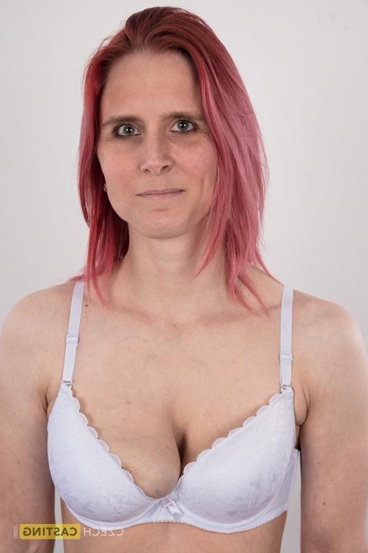 20P Redhead amateur Kveta shows her mismatched breasts while standing naked