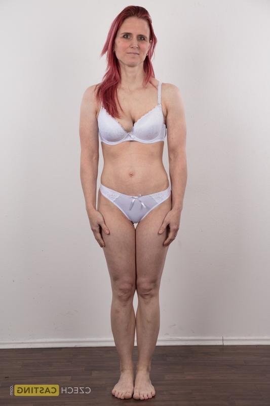 20P Redhead amateur Kveta shows her mismatched breasts while standing naked
