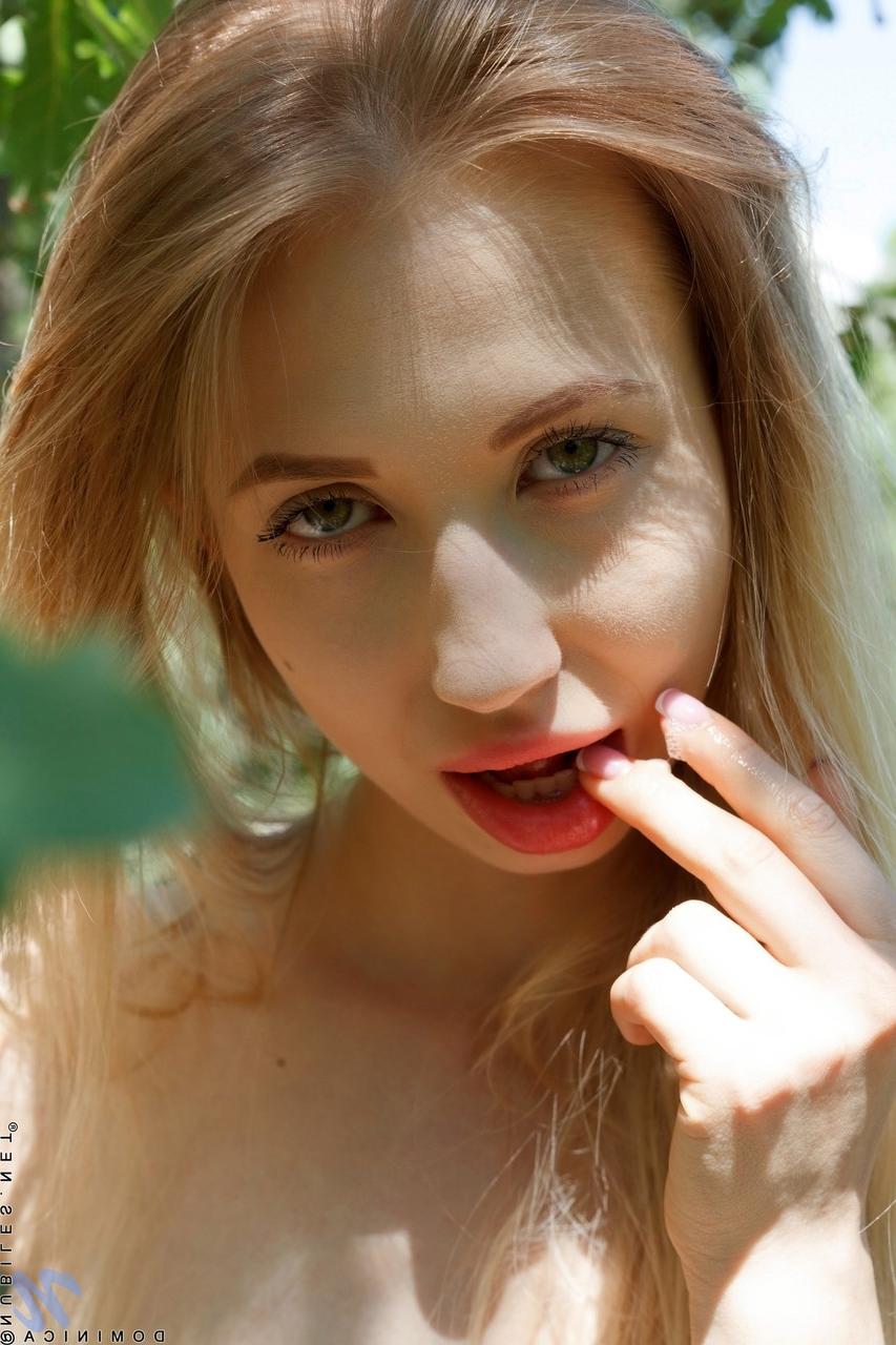 20P Long-haired babe Dominica stripping and fingering herself in the forest