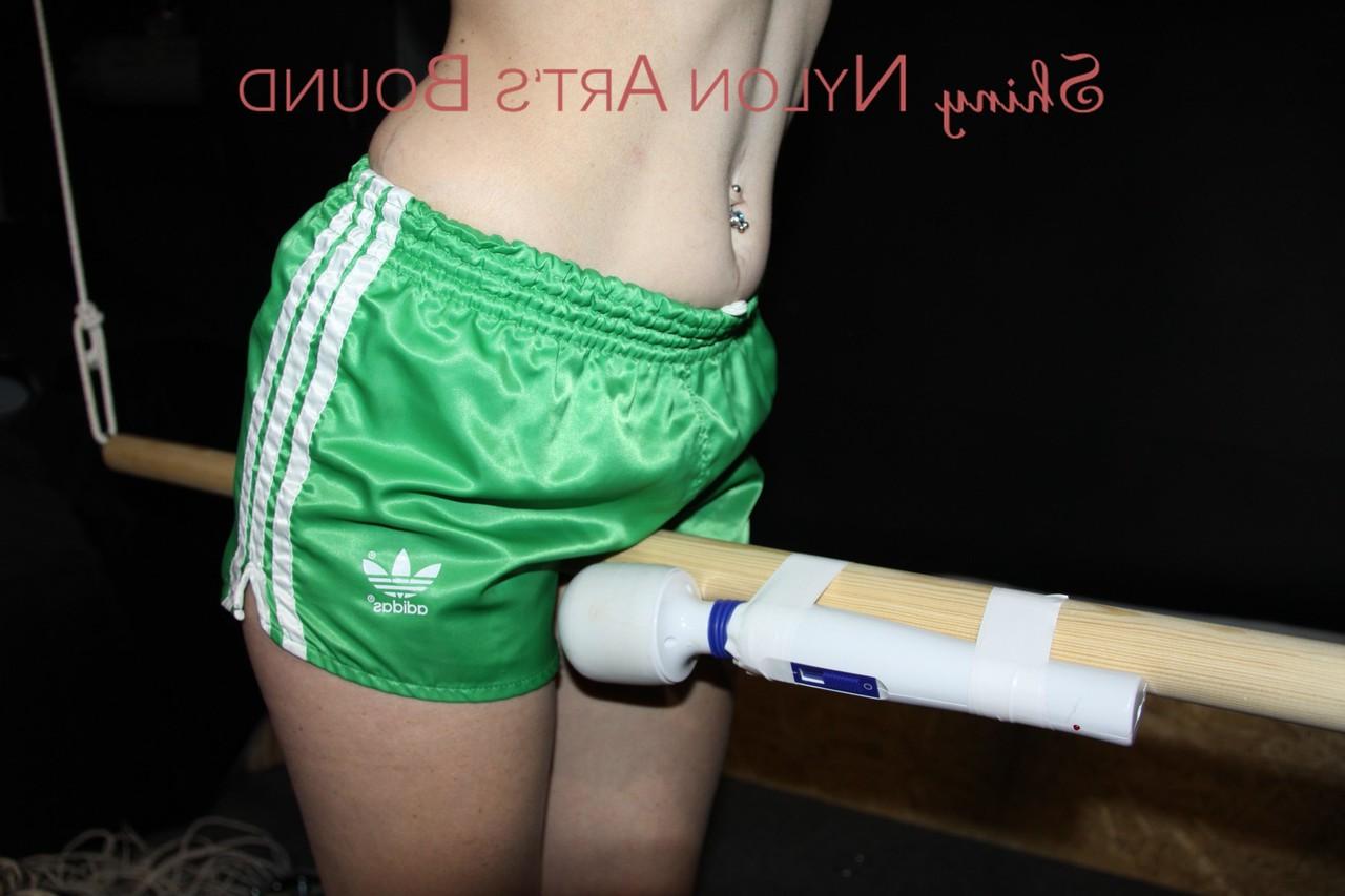 16P White girl has a vibrator applied to her cunt while restrained in nylon shorts