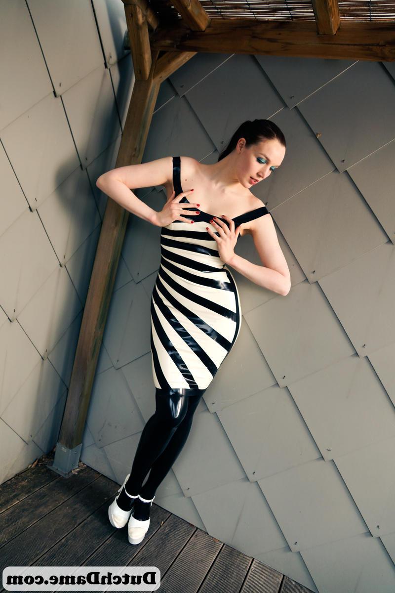16P Sexy slut in latex leggings dons latex mask & cuffs to model in tight dress