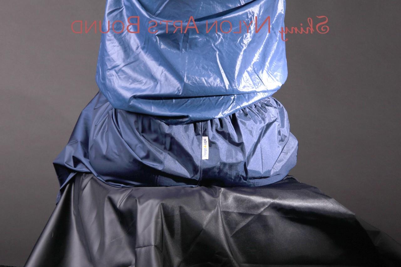 16P Caucasian female is restrained and gagged in a raincoat and rubber boots