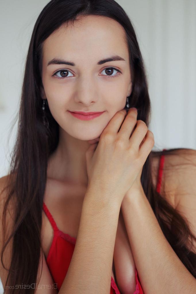 16P Dark haired teen with a pretty face gets around to baring her bald snatch