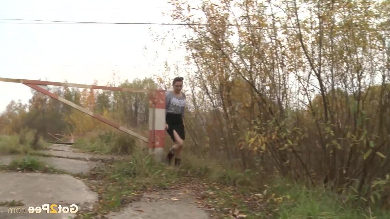 15P Unawares lady gets caught on spy cam hiking her skirt and taking a pee on path