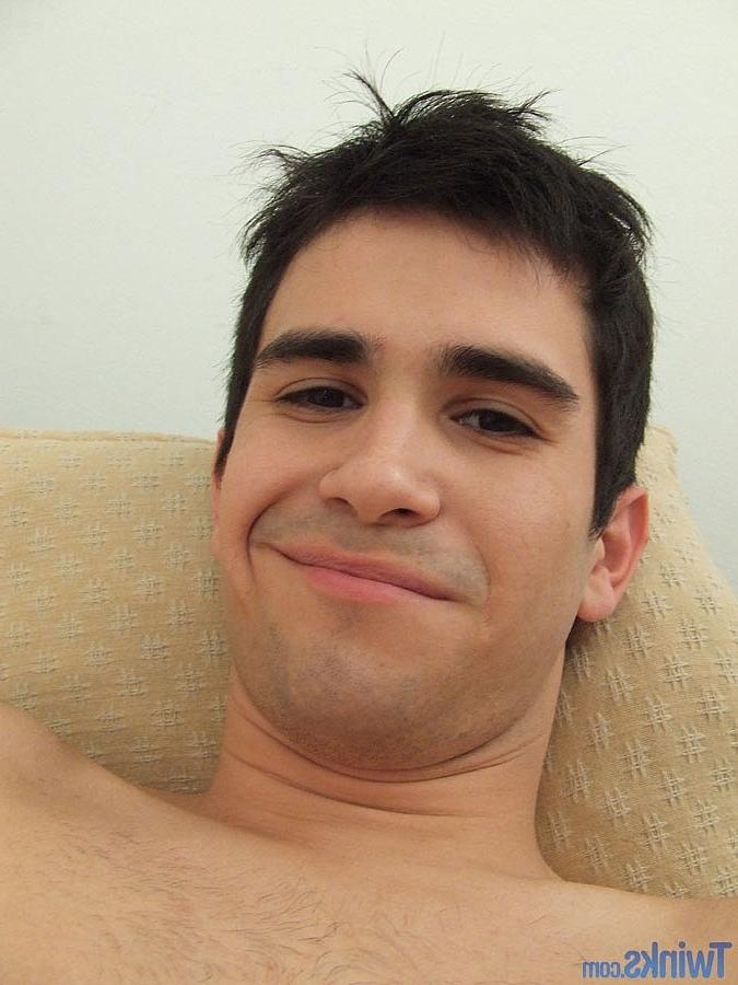 20P Good-looking twink jerks his big dick until he ejaculates on the couch