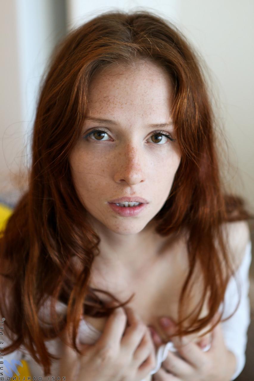 20P Alluring redhead Zazi Darling plays with her welcoming hairy pussy
