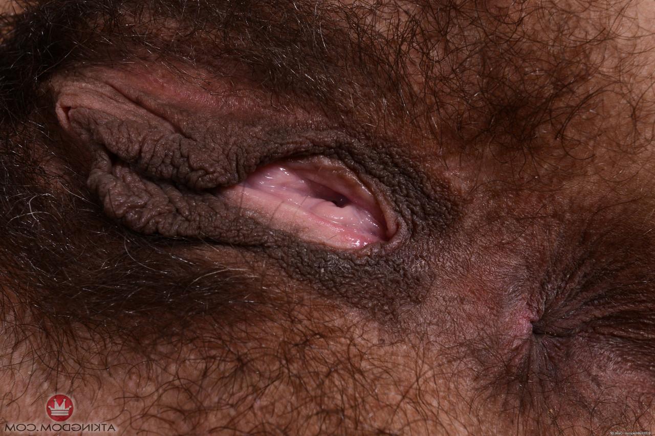 20P Mature amateur Delta Hauser undresses and shows her super hairy holes
