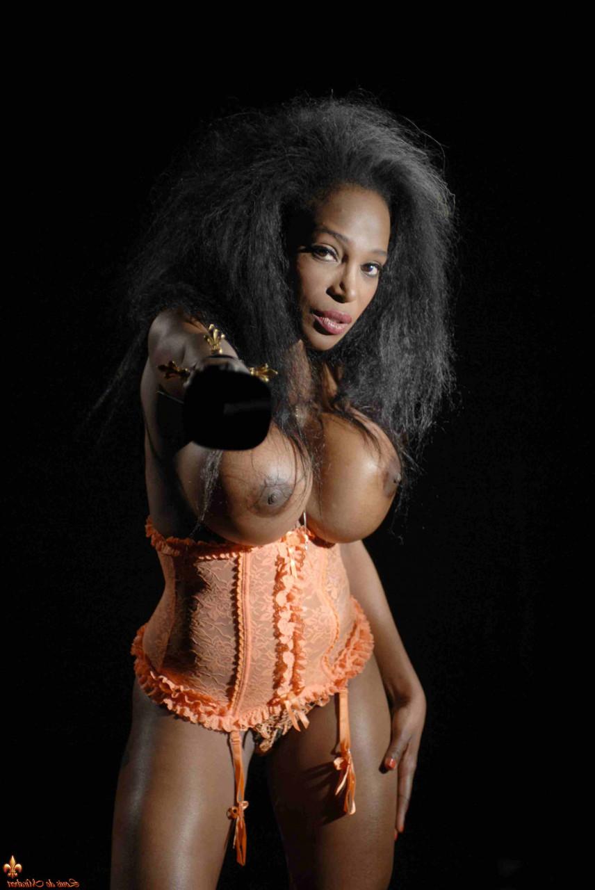 16P Ebony model Felina displays her augmented breasts while wearing lingerie