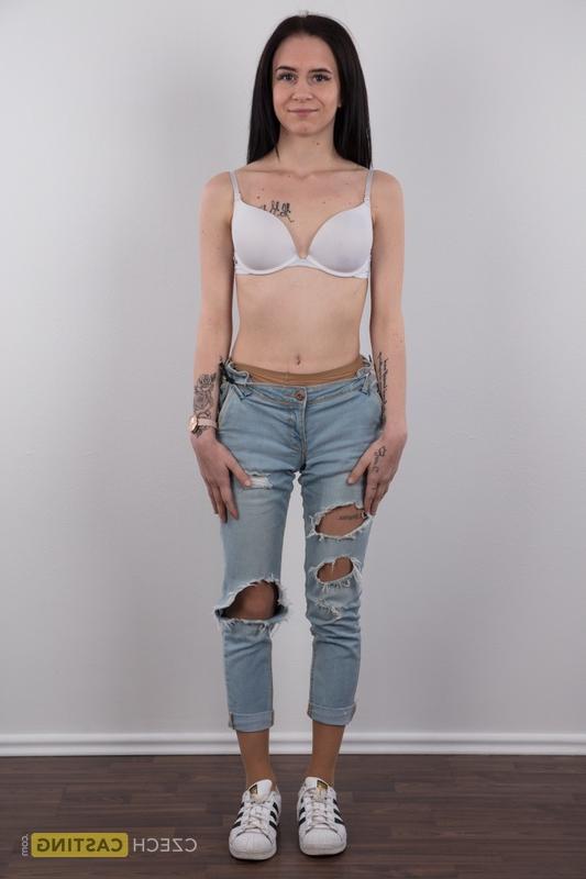 18P Long haired female Barbora models in ripped jeans before standing bare naked