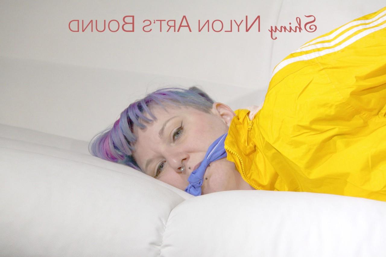 16P Fair skinned girl is left tied up and gagged in nylon athletic wear