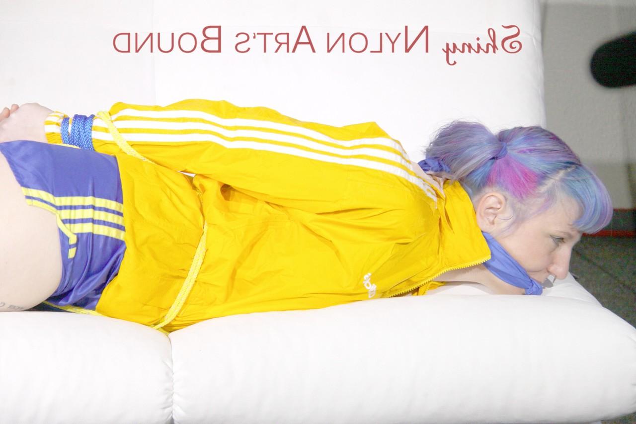 16P Fair skinned girl is left tied up and gagged in nylon athletic wear