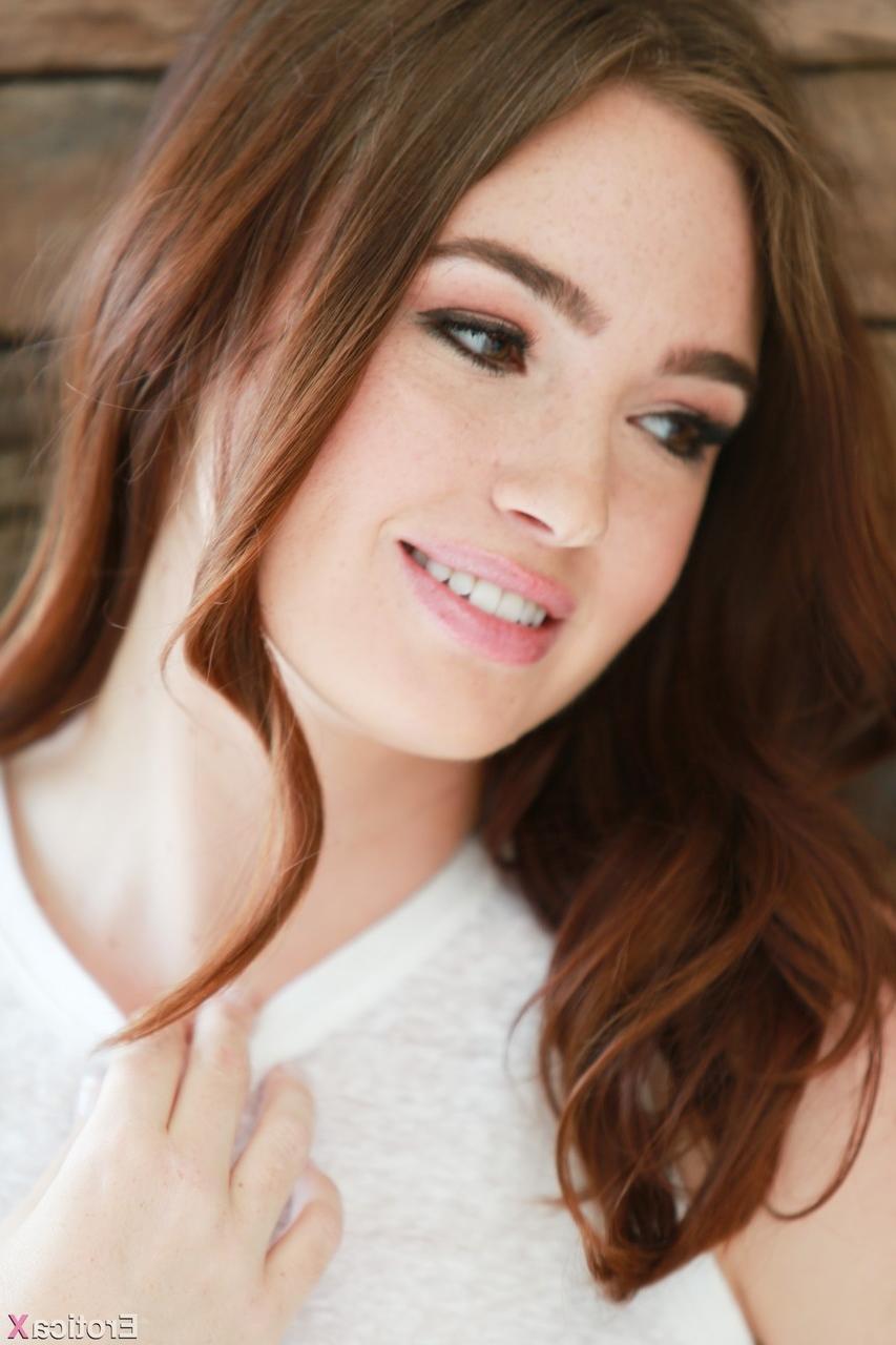 15P Glamorous brunette model Jodi Taylor shows natural tits and bushy vagina