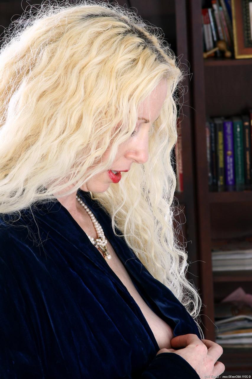 20P Curly-haired MILF Lilly shows her big tits and hairy holes in a solo