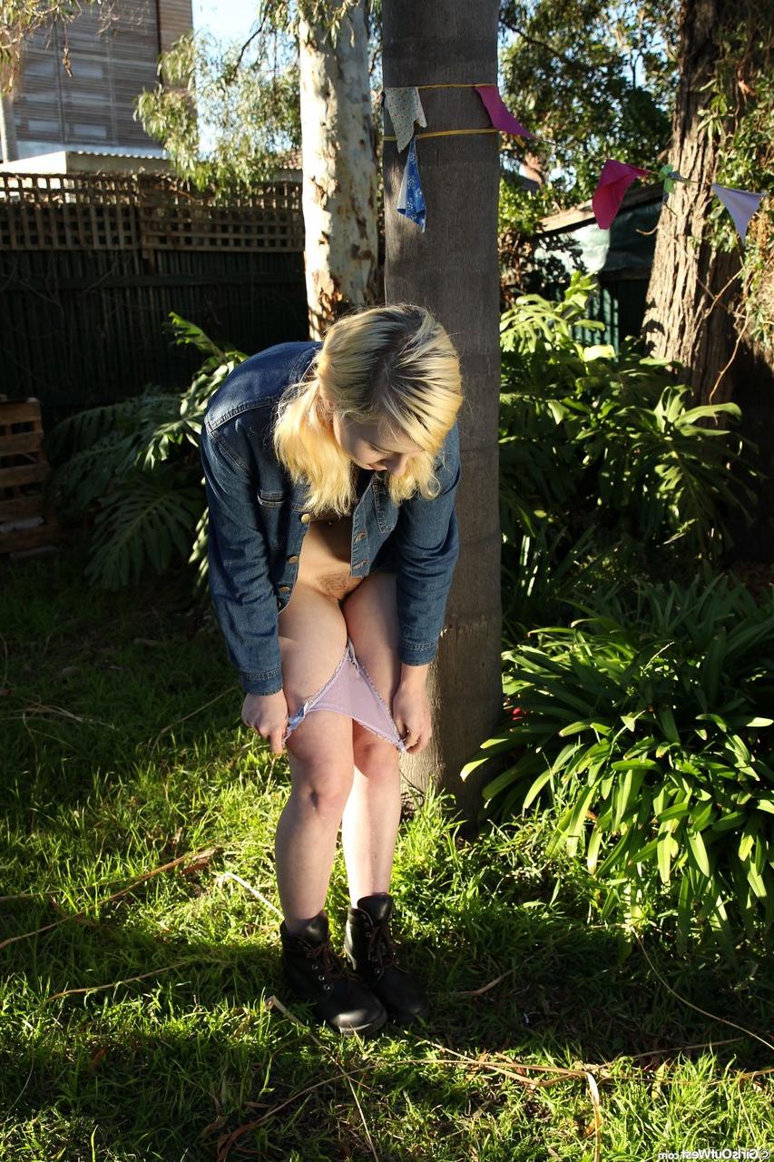 18P Blonde chick with small tits Mae displays her bushy snatch outdoors