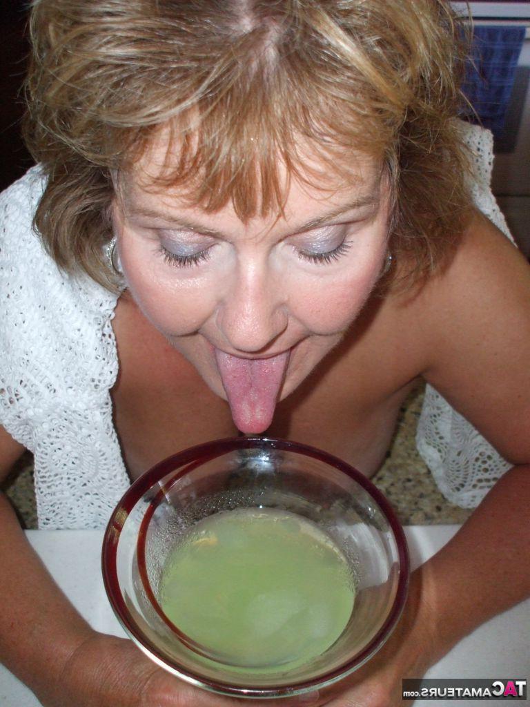 19P Mature amateur BustyBliss goes topless while enjoying a glass of booze