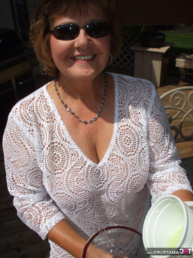 19P Mature amateur BustyBliss goes topless while enjoying a glass of booze