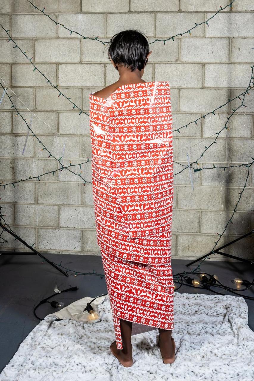 20P Slim ebony with elf ears Britney Siren upacks herself from a decorative paper