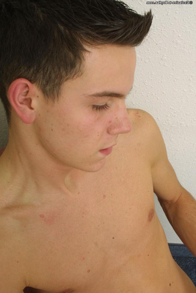 20P Gay brunette Trent Williams strips down naked and gently strokes his cut dick