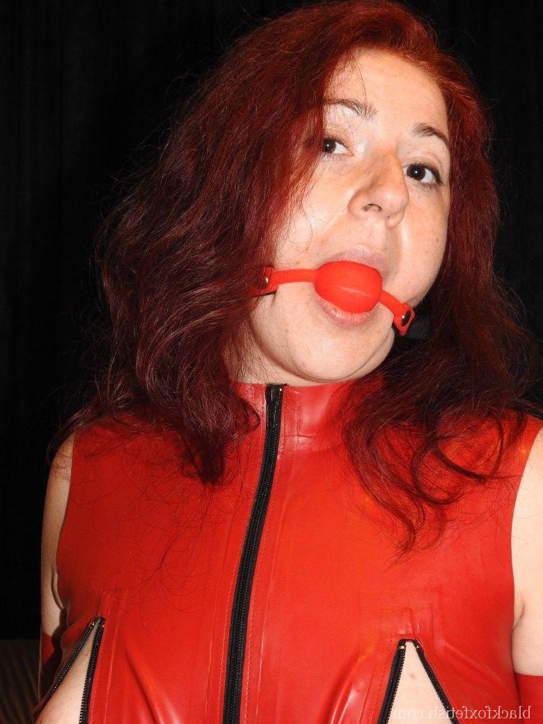 16P Submissive redhead has clamps attached to her nipples while ball gagged