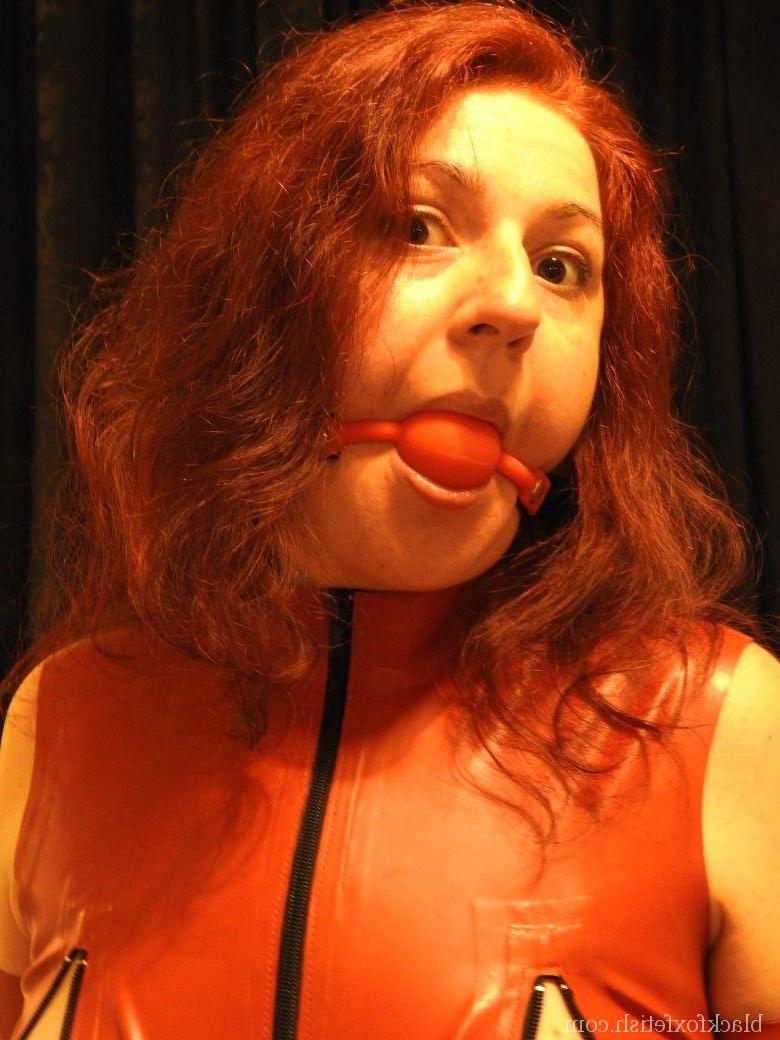 16P Submissive redhead has clamps attached to her nipples while ball gagged
