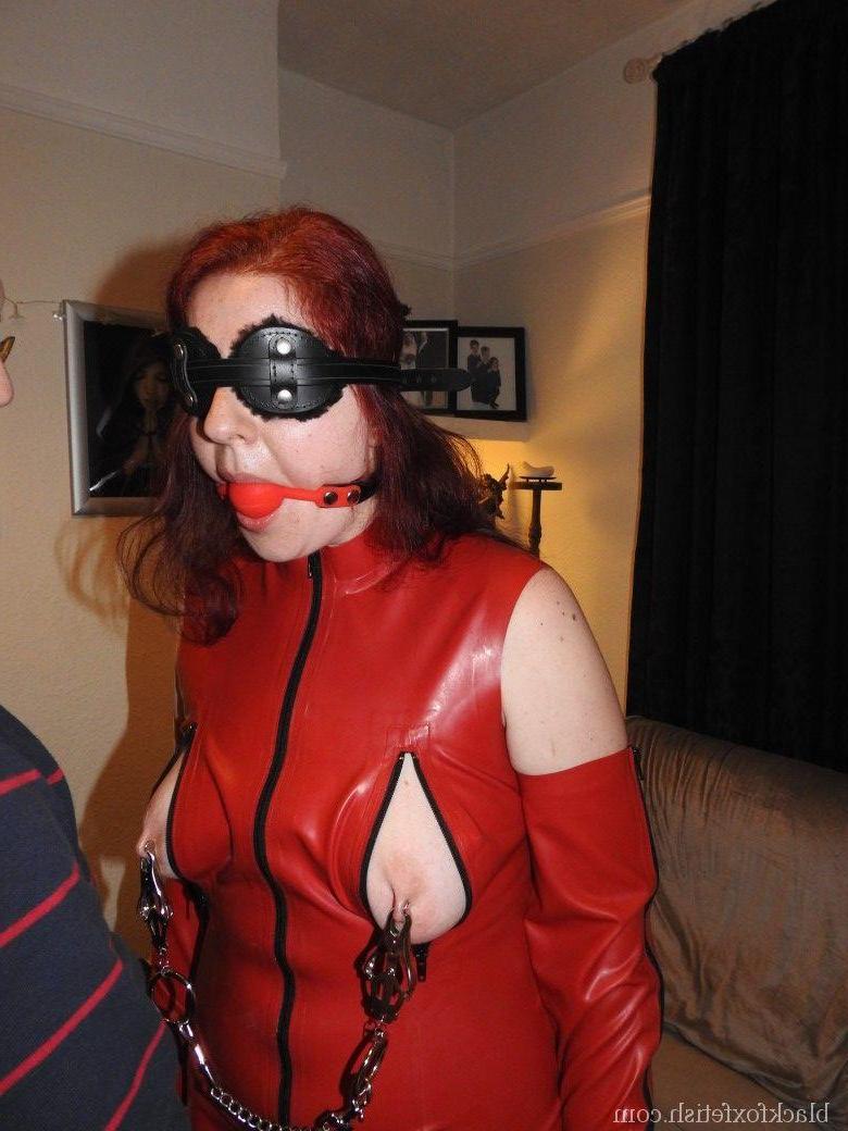 16P Submissive redhead has clamps attached to her nipples while ball gagged