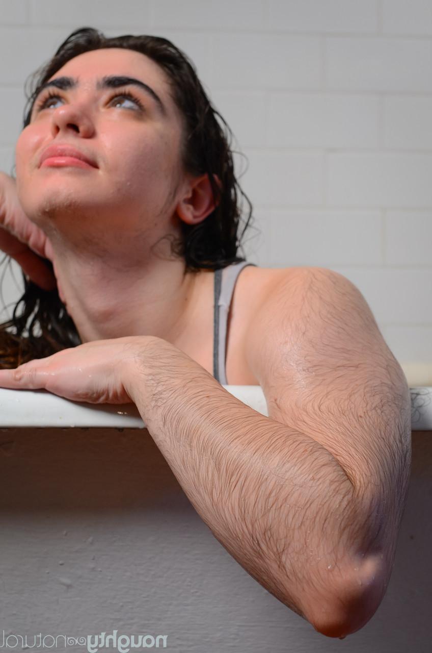 20P Hairy seductress Kisa Fae strips in the bathtub and washes herself