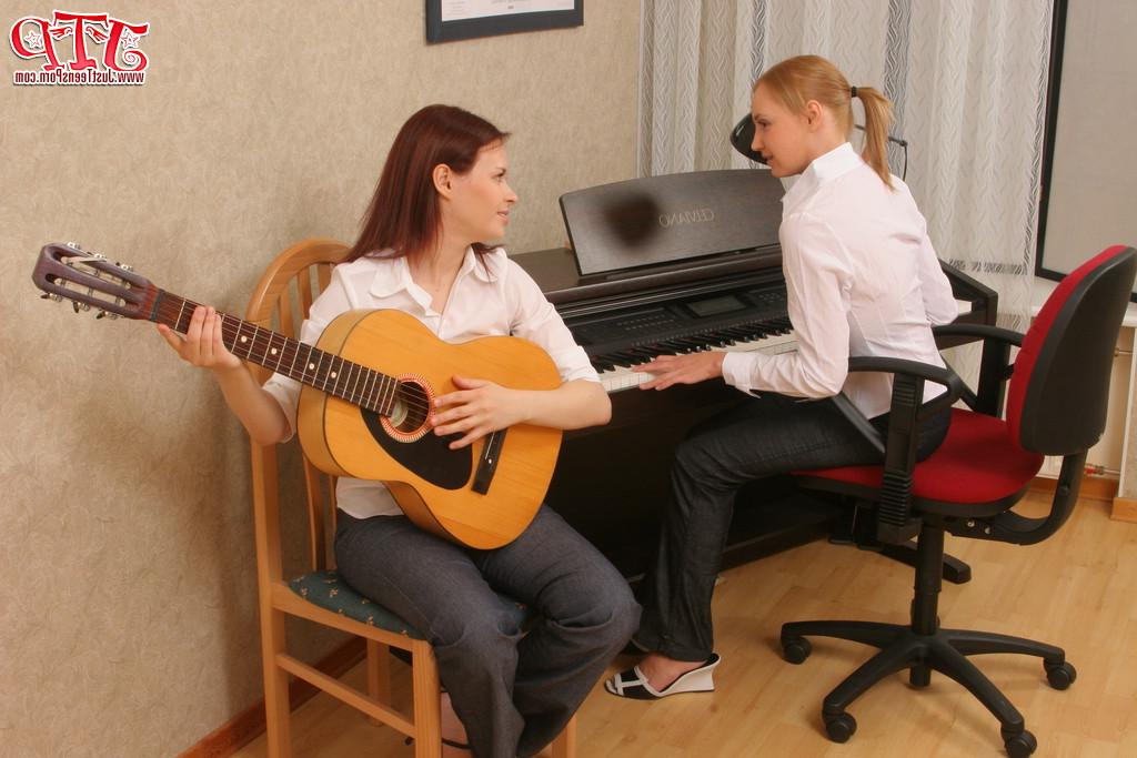 20P Lesbian girls make music before making love on a hardwood floor