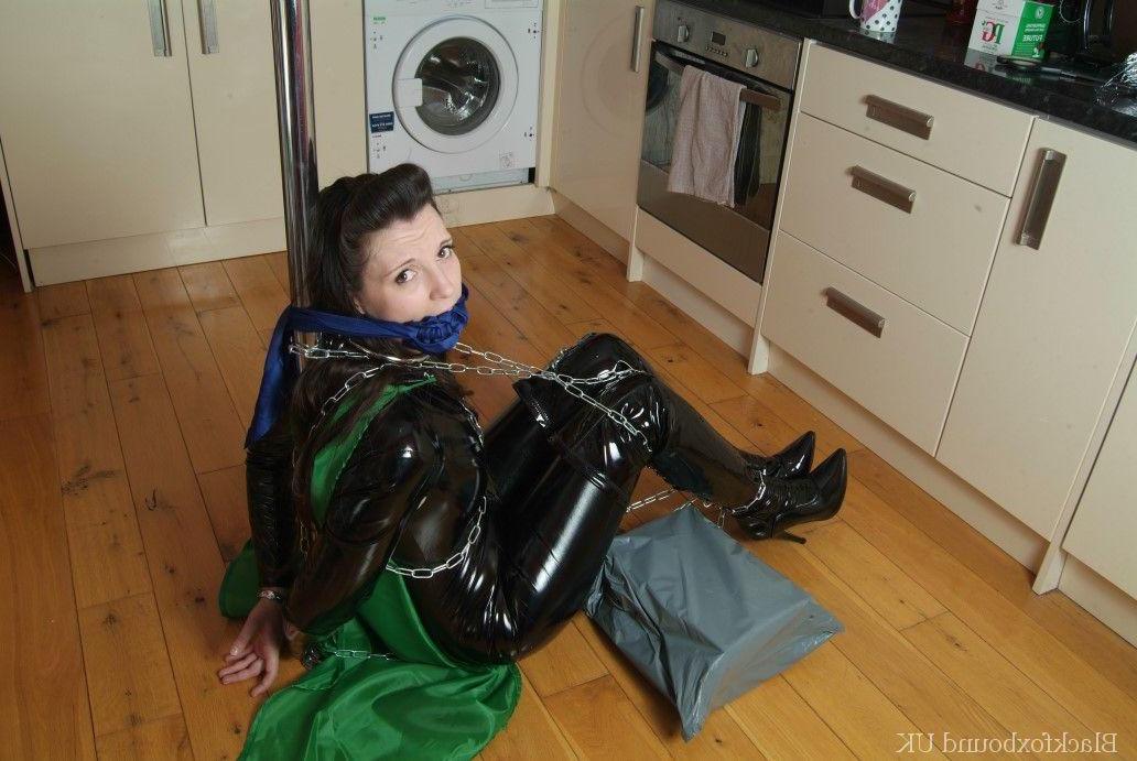 16P Solo girl finds herself restrained with chains in black latex clothing