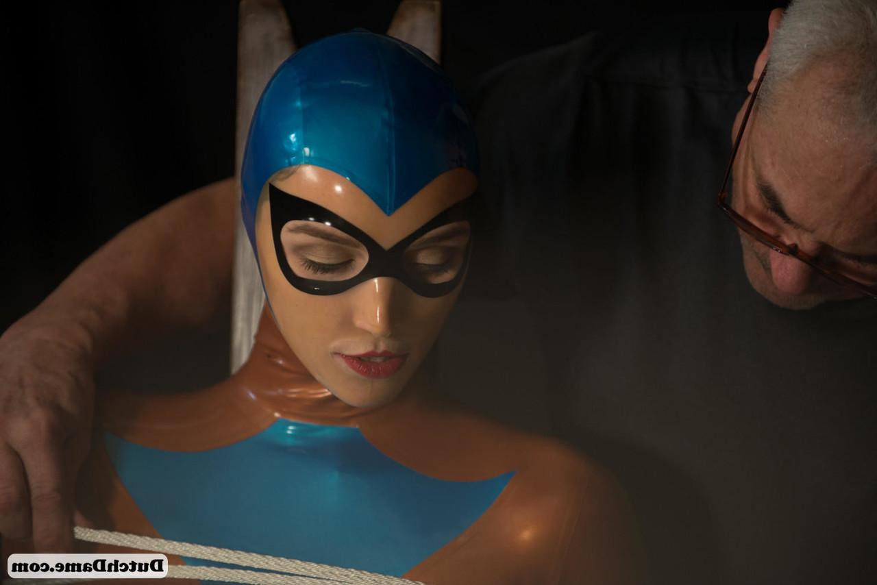 16P Latex attired female is is kept in captivity by rope bindings