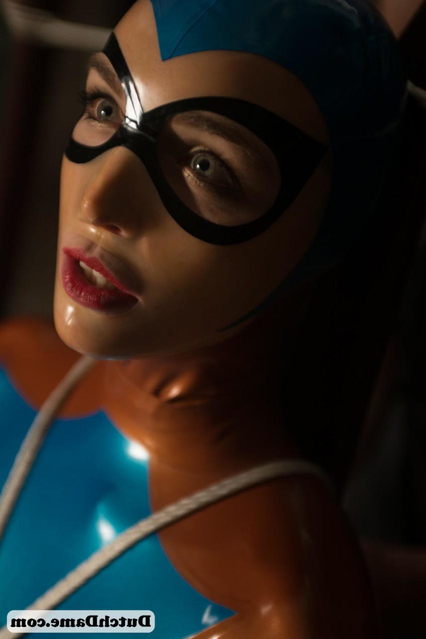 16P Latex attired female is is kept in captivity by rope bindings