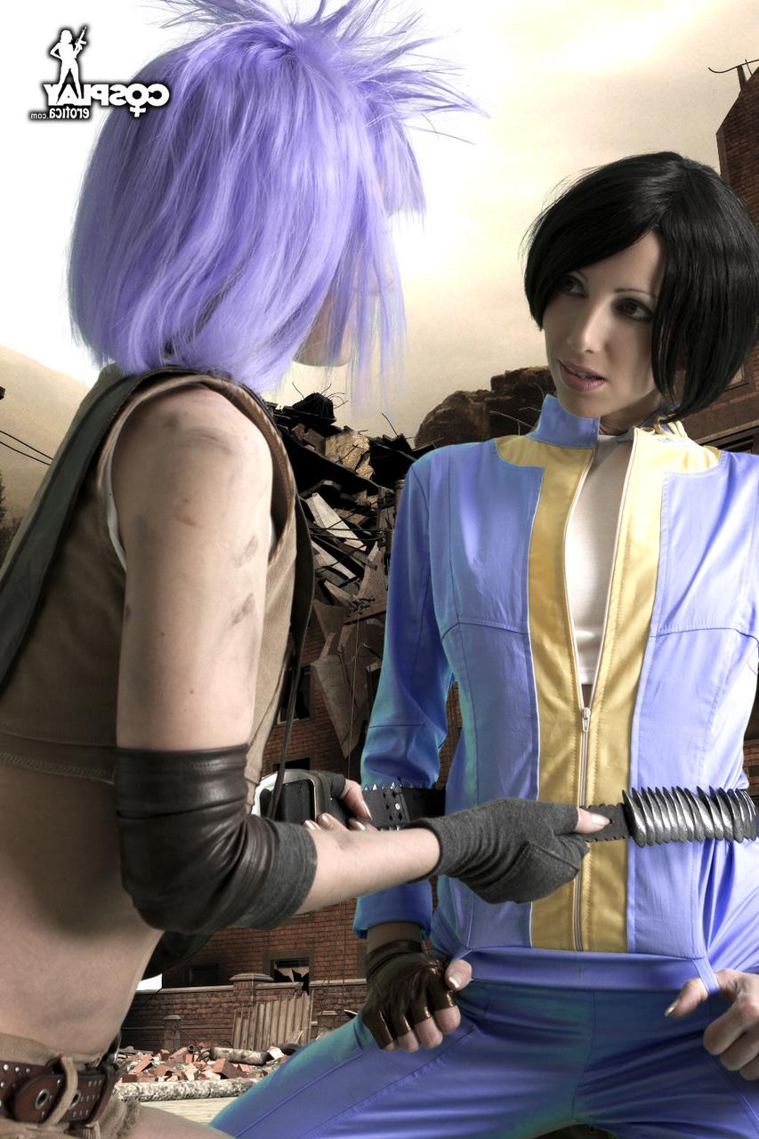 12P Lesbian cosplayers pause for a tongue kiss while holding their weapons