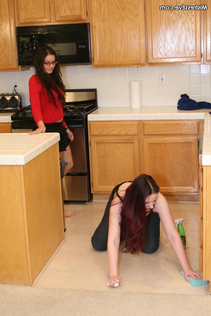 12P Submissive girl is forced to lick her lesbian lover's feet in a kitchen