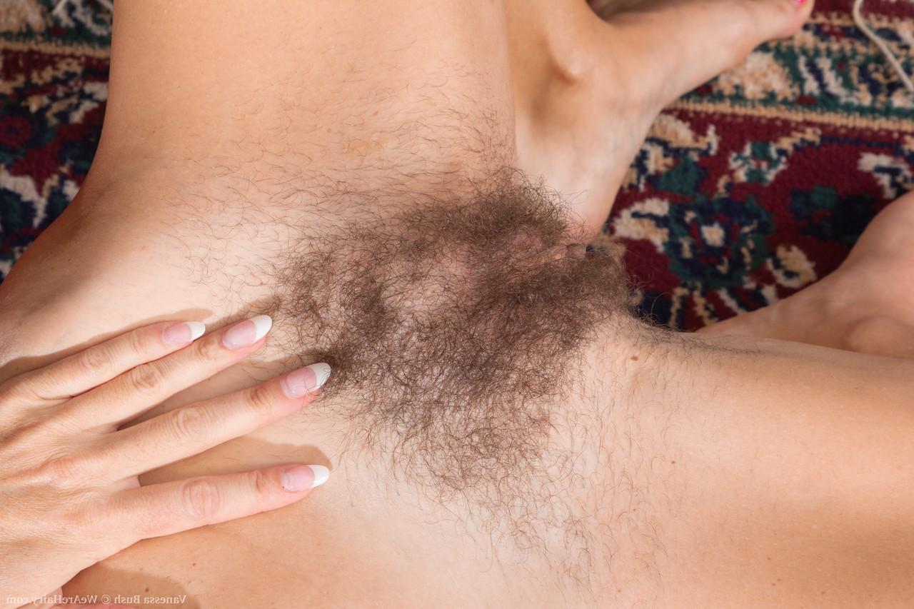 20P Tiny boobed MILF Vanessa Bush strips & bares her hairy pussy on the carpet