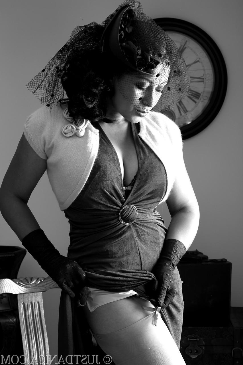 20P Elegant MILF Danica Collins strips to her lingerie and shows off her knockers