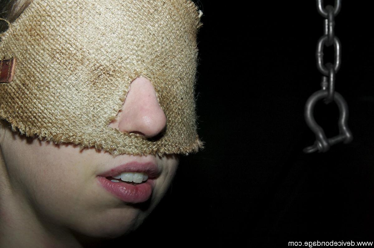 17P Brunette Alyssa in metal collar combined with handcuffs in the dark dungeon