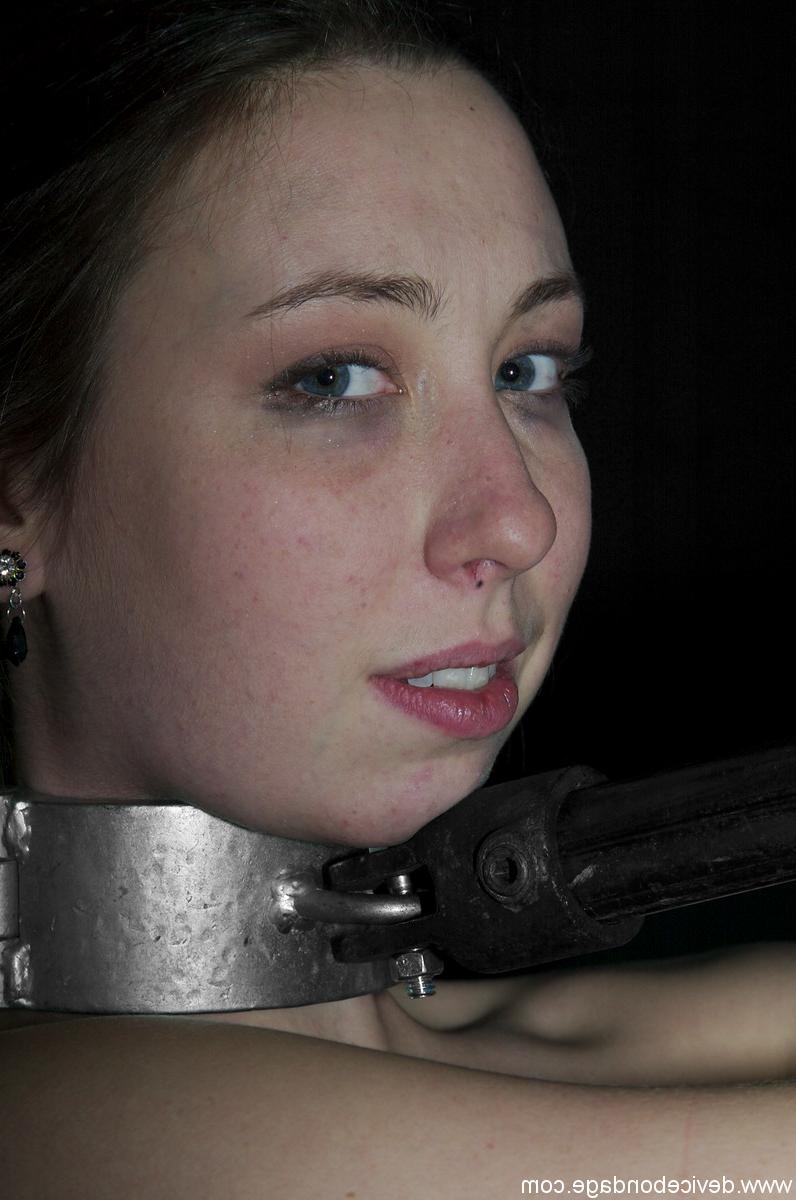 17P Brunette Alyssa in metal collar combined with handcuffs in the dark dungeon