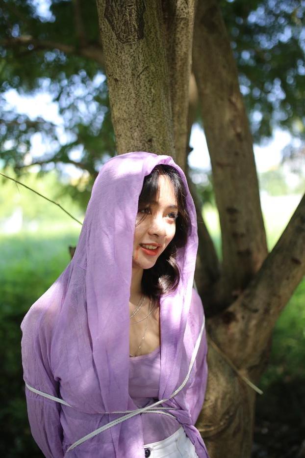20P Asian seductress Nhatle posing in her amazing Halloween costume outdoors