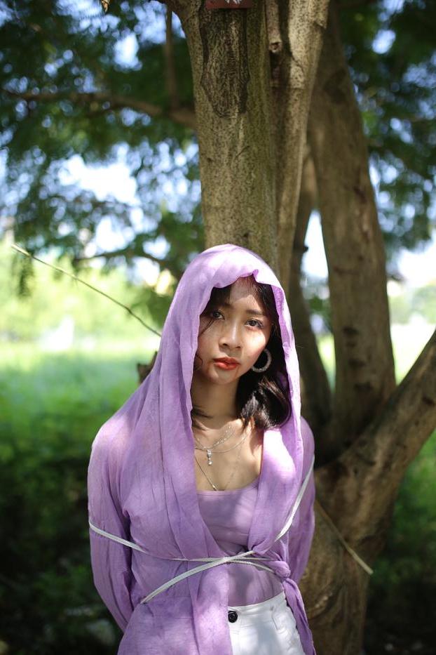 20P Asian seductress Nhatle posing in her amazing Halloween costume outdoors