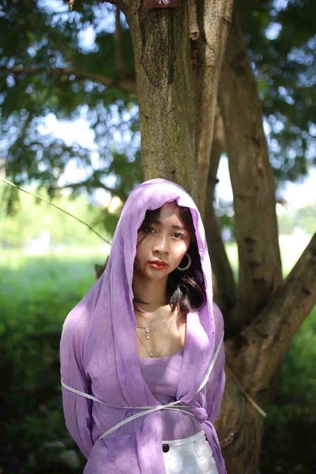 20P Asian seductress Nhatle posing in her amazing Halloween costume outdoors